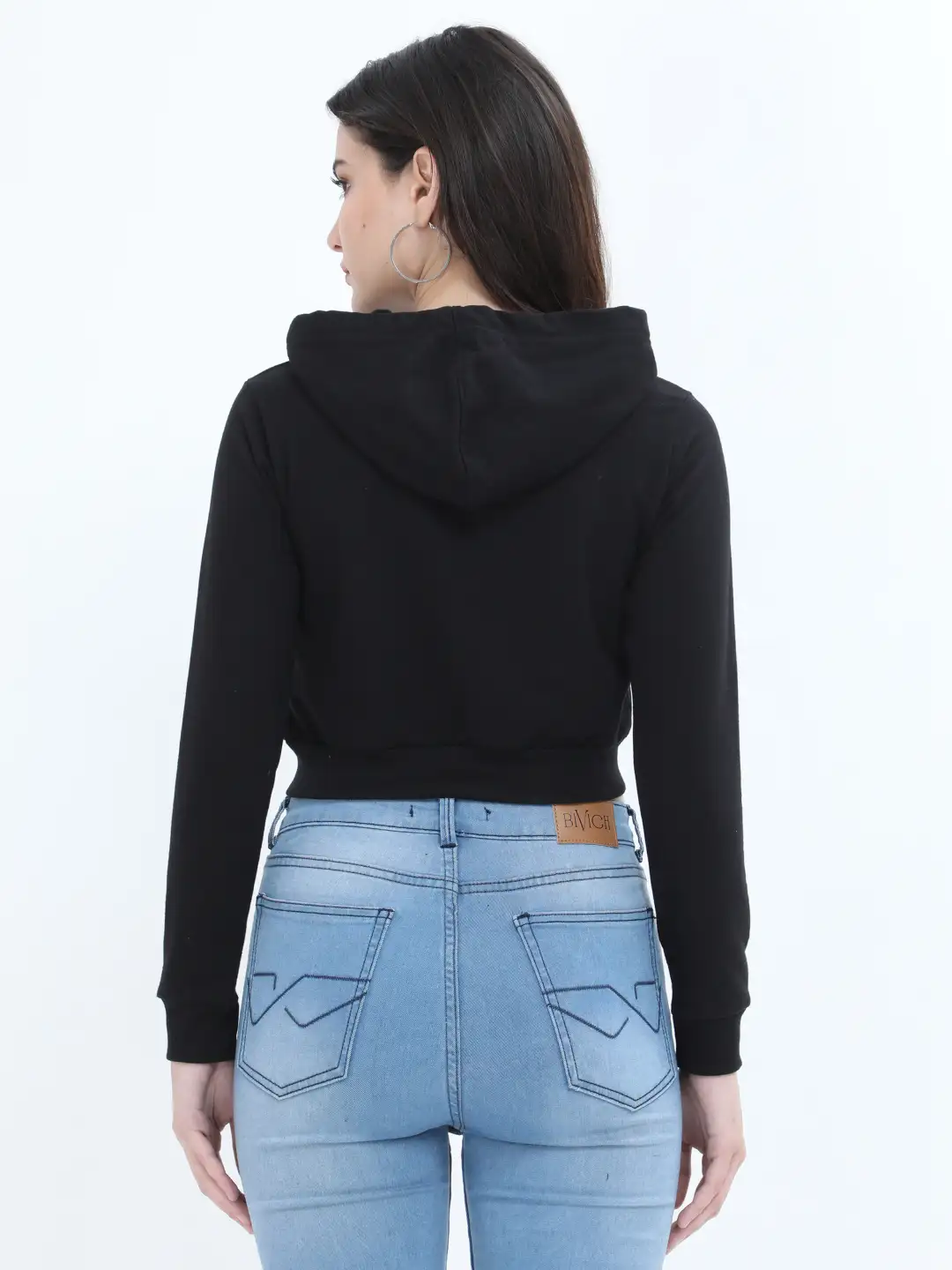 Women Wearing a Black Crop Hoodie Looking Sideways.